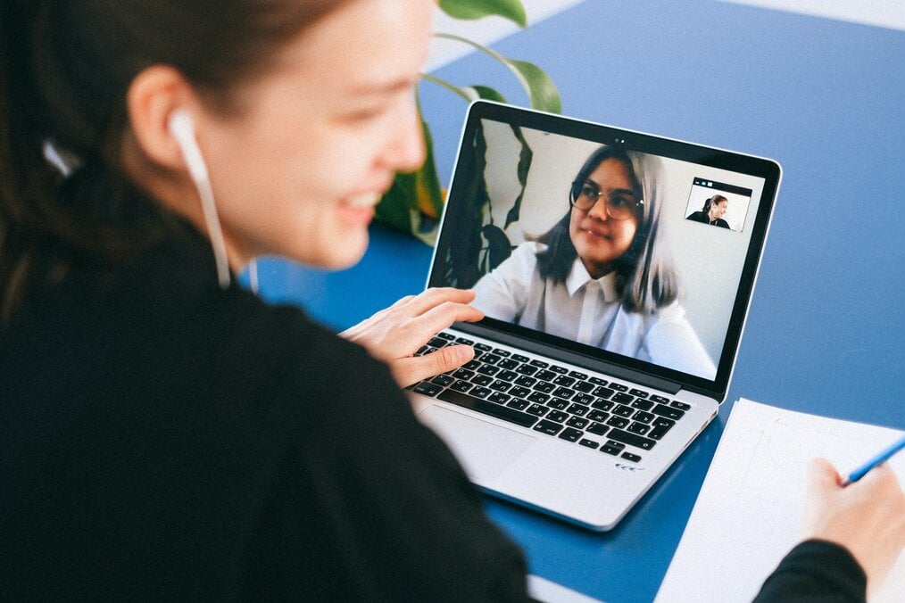 Person on video call on laptop